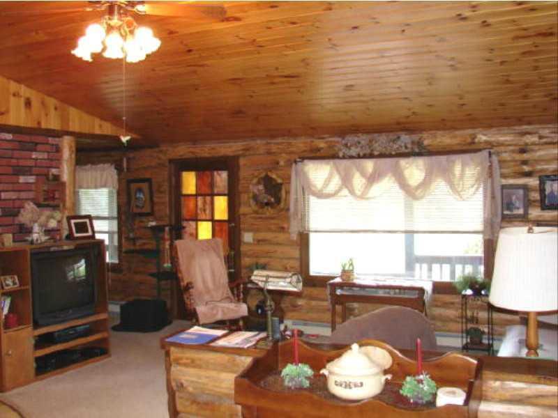 1388 South Solon Road Solon, ME 04979 - Photo 5 of 21 Living Room. log home living room