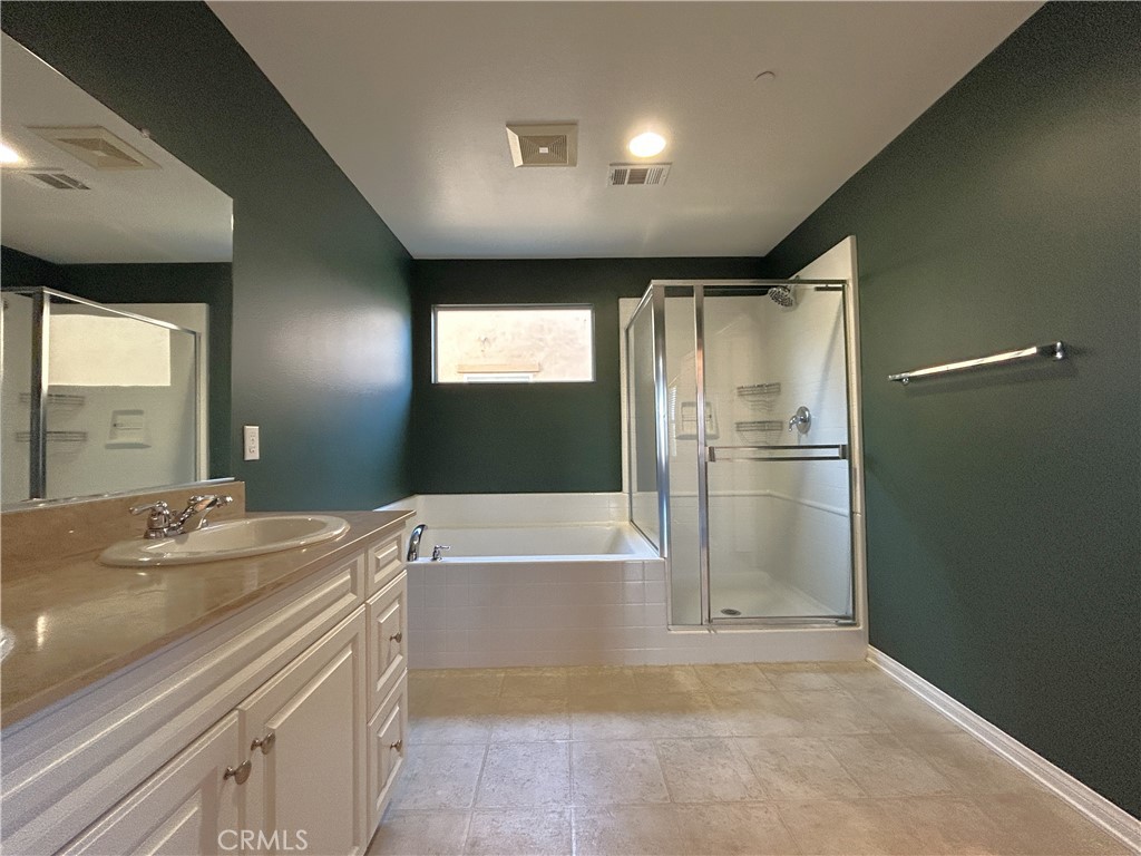 16051 Nature Chino, CA 91708 - Photo 18 of 41 a bathroom with a tub sink and a mirror