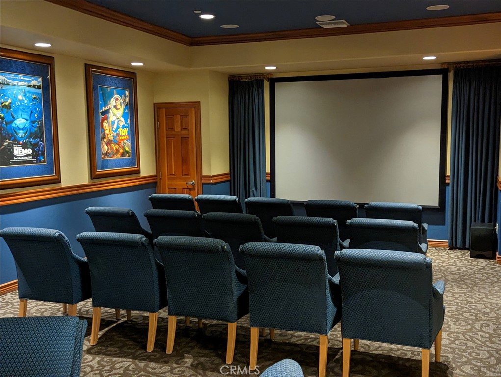 16051 Nature Chino, CA 91708 - Photo 34 of 41 a media room with lots of chairs and a projector screen