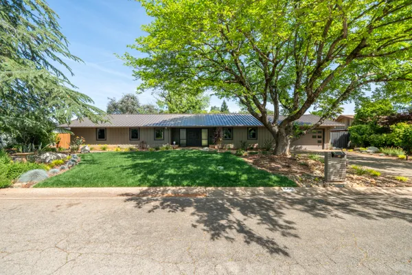 a front view of a house with a yard