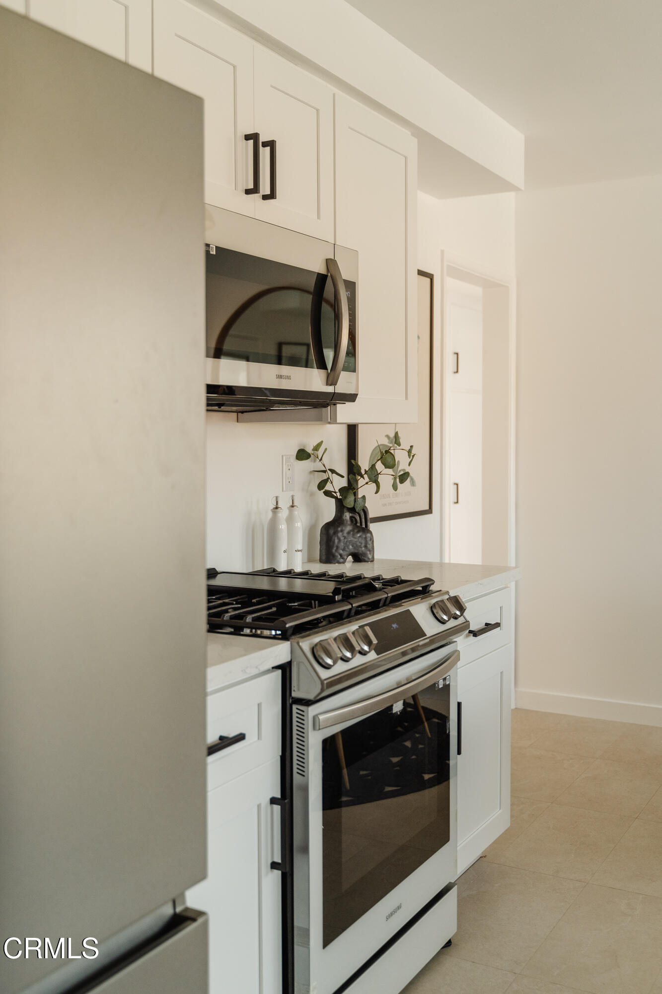 43 East Pamela Road Arcadia, CA 91006 - Photo 11 of 22 a kitchen with stainless steel appliances granite countertop a stove and a microwave