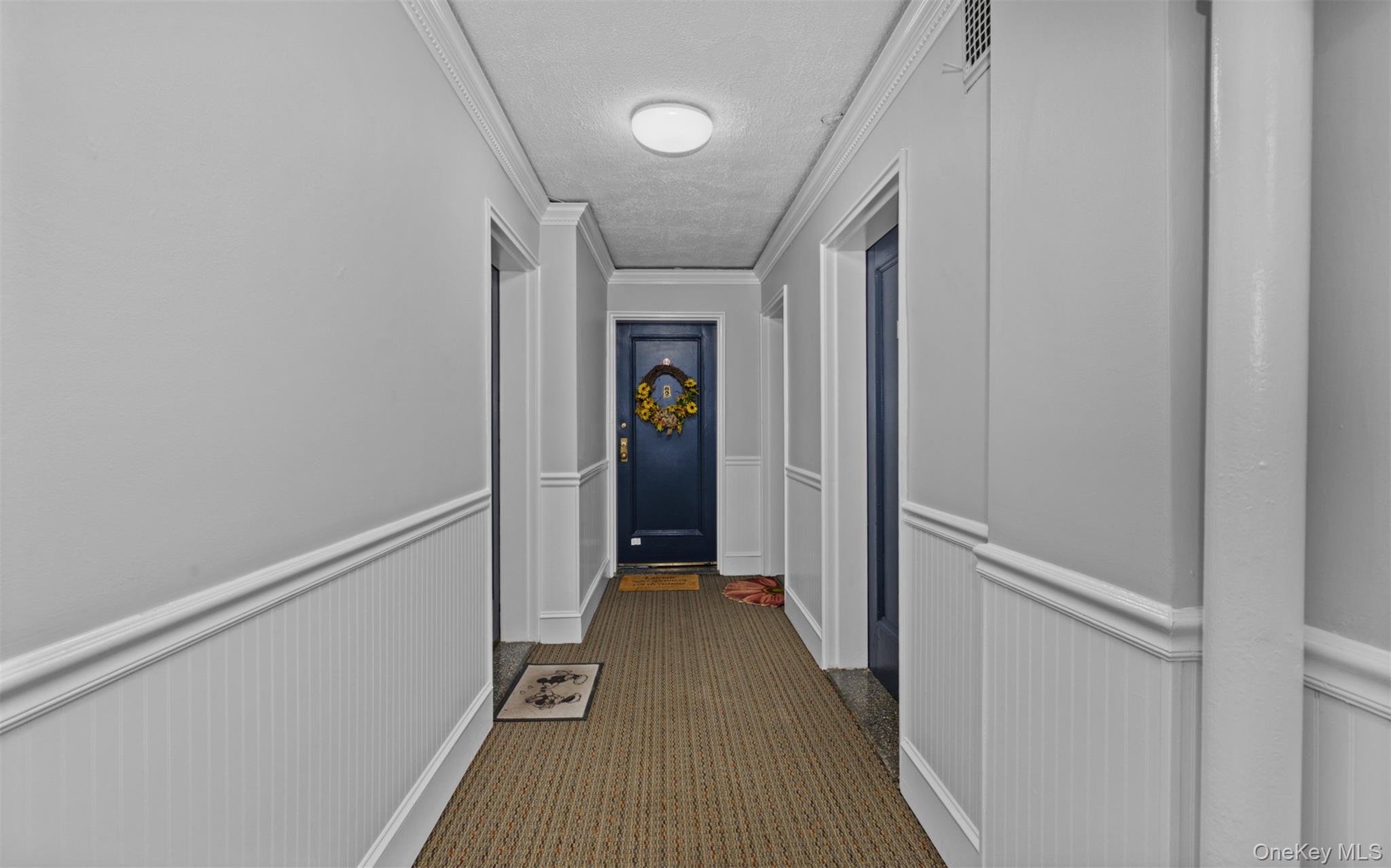 32 Cathedral Avenue, Unit 6C Hempstead, NY 11550 - Photo 5 of 14 a view of hallway with stairs