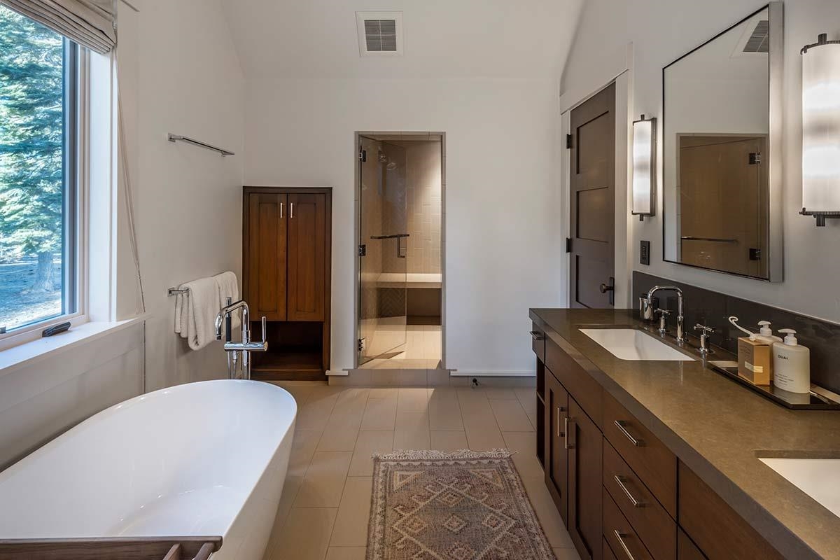8262 Valhalla Drive Truckee, CA 96161 - Photo 14 of 21 a en suite bathroom with a double vanity sink and a mirror