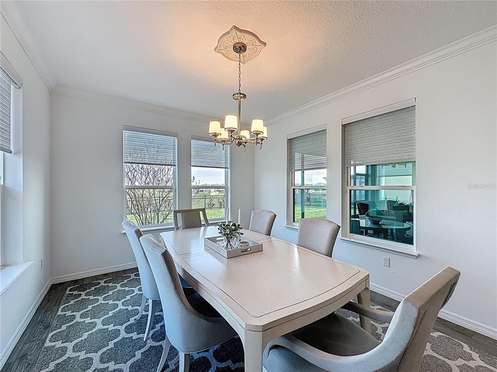 178 Silver Maple Road Groveland, FL 34736 - Photo 16 of 72 a view of a dining room with furniture window and outside view