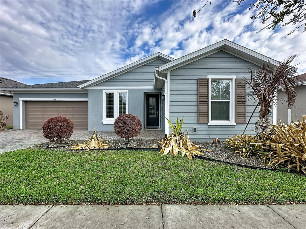 178 Silver Maple Road Groveland, FL 34736 - Photo 2 of 72 a backyard of a house with table and chairs