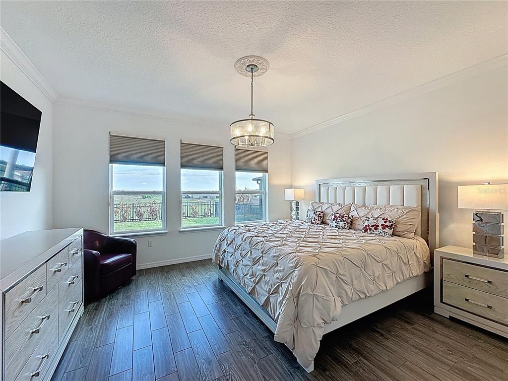 178 Silver Maple Road Groveland, FL 34736 - Photo 23 of 72 a bedroom with a bed and a window