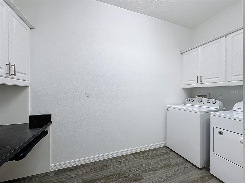 178 Silver Maple Road Groveland, FL 34736 - Photo 32 of 72 a view of utility room with washer and dryer