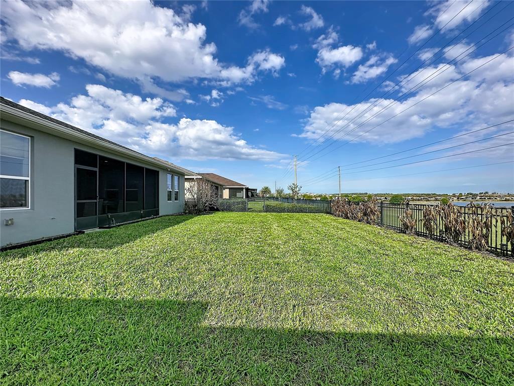 178 Silver Maple Road Groveland, FL 34736 - Photo 42 of 72 a view of a house with backyard and garden