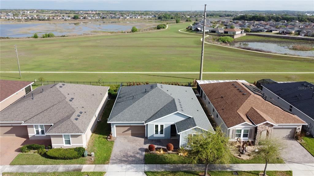178 Silver Maple Road Groveland, FL 34736 - Photo 48 of 72 an aerial view of a house with a lake view