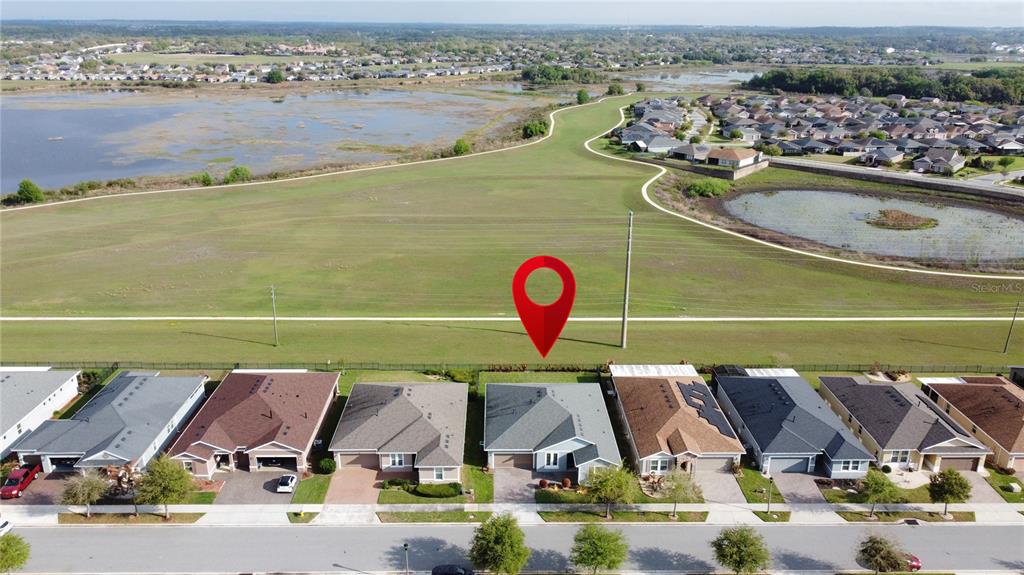 178 Silver Maple Road Groveland, FL 34736 - Photo 51 of 72 an aerial view of a swimming pool and lake view