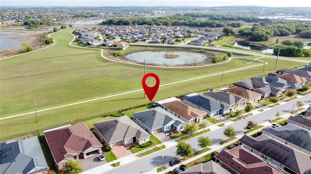 178 Silver Maple Road Groveland, FL 34736 - Photo 52 of 72 a view of a swimming pool with a patio