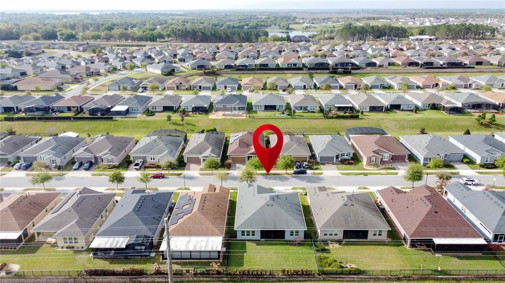 178 Silver Maple Road Groveland, FL 34736 - Photo 54 of 72 an aerial view of residential houses with outdoor space and swimming pool
