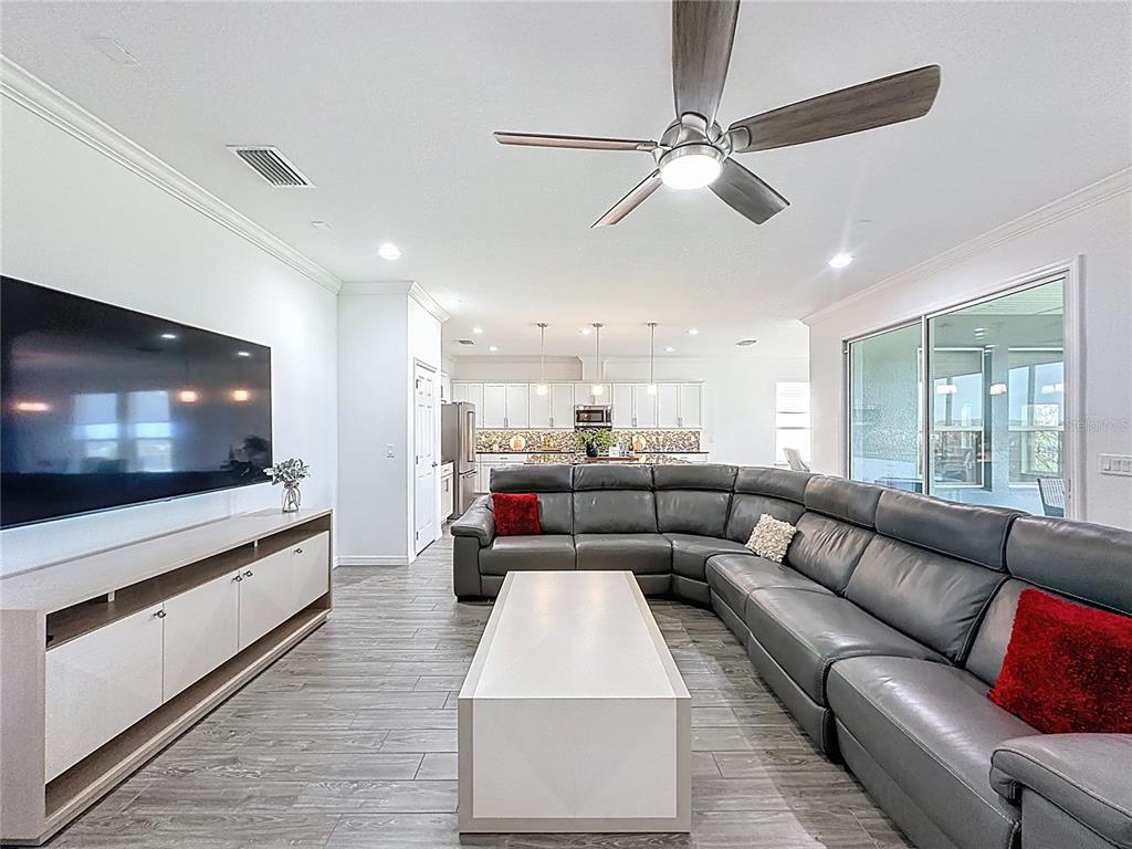 178 Silver Maple Road Groveland, FL 34736 - Photo 8 of 72 a living room with furniture and a flat screen tv