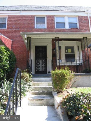2209 Monticello Road Baltimore, MD 21216 - Photo 1 of 30 a front view of a house with a yard