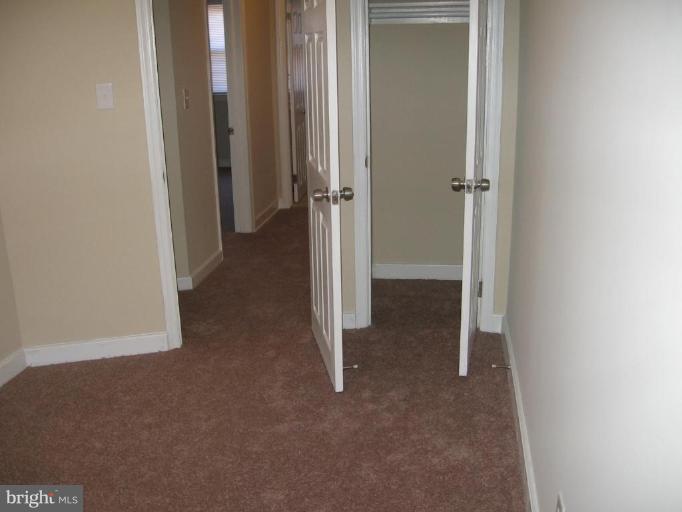 2209 Monticello Road Baltimore, MD 21216 - Photo 18 of 30 a view of a room with wooden wall