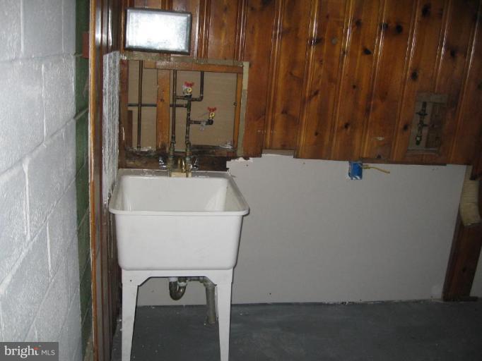 2209 Monticello Road Baltimore, MD 21216 - Photo 21 of 30 a bathroom with a sink