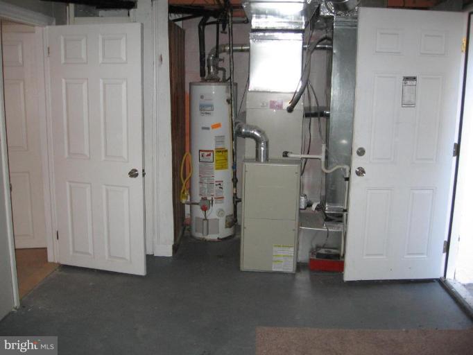 2209 Monticello Road Baltimore, MD 21216 - Photo 23 of 30 a view of empty room with entrance and stairs