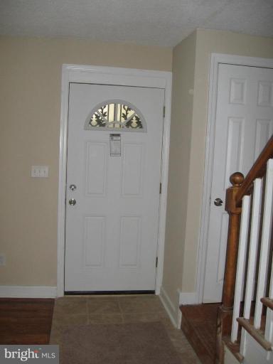 2209 Monticello Road Baltimore, MD 21216 - Photo 4 of 30 a view of an entryway with chandelier