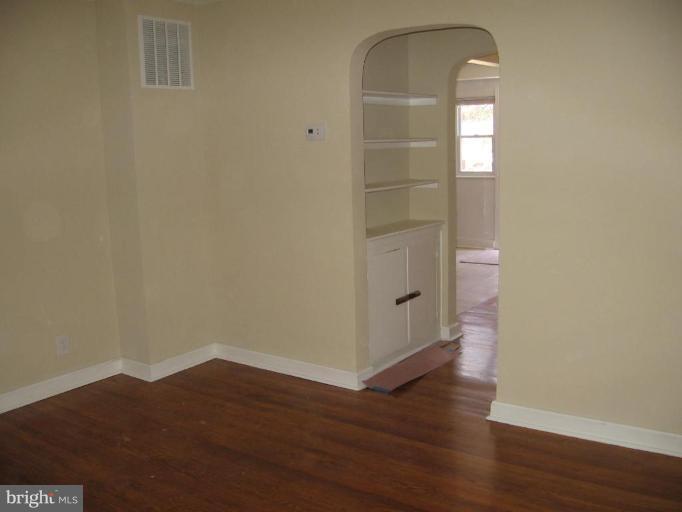 2209 Monticello Road Baltimore, MD 21216 - Photo 5 of 30 a view of empty room with wooden floor