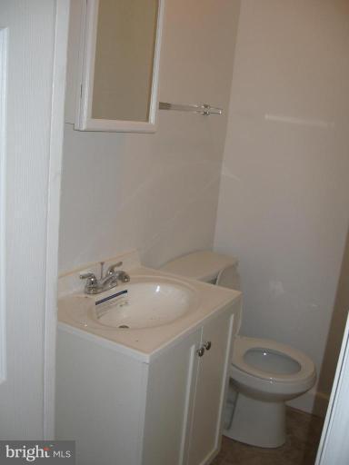 2209 Monticello Road Baltimore, MD 21216 - Photo 6 of 30 a bathroom with a sink and toilet