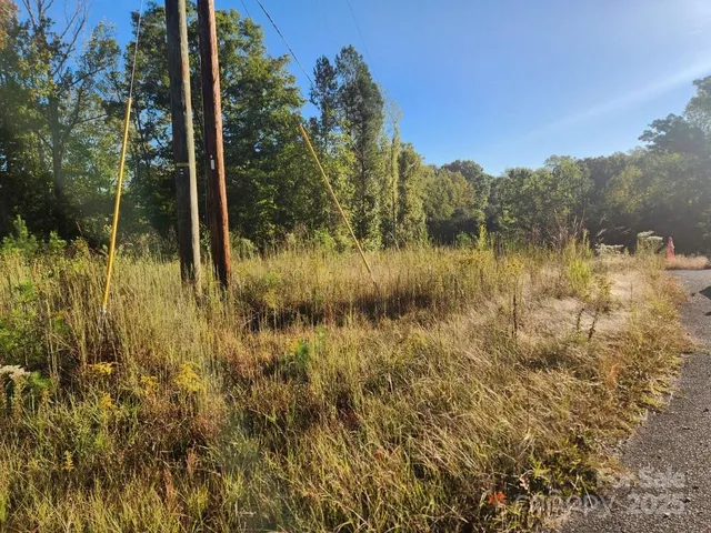 a view of a lake with a house in the background