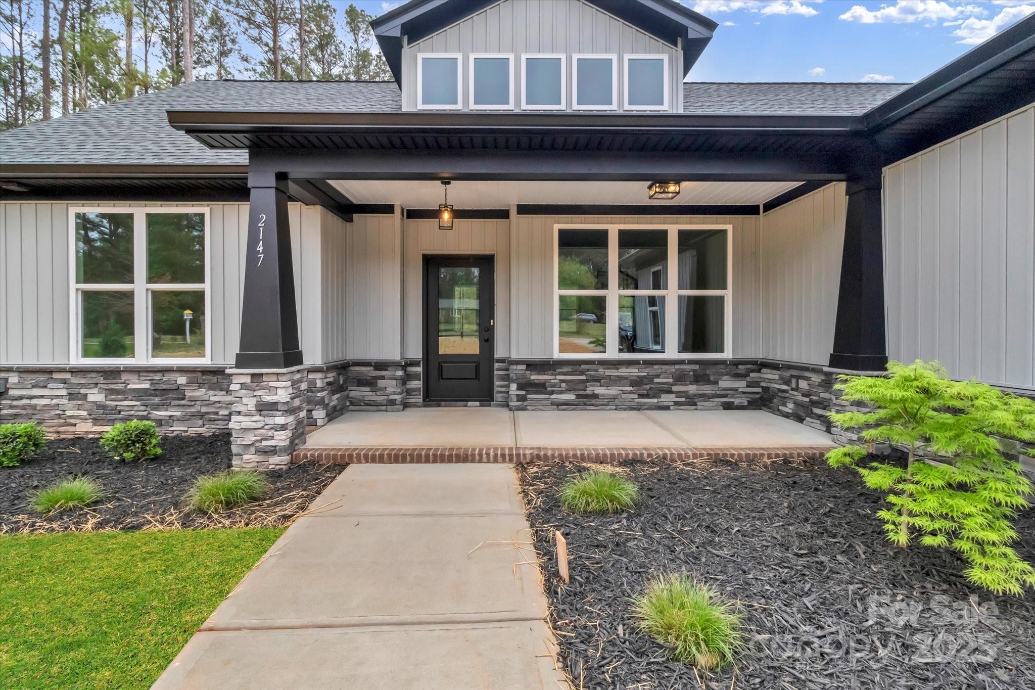 2147 Dunlap Roddey Road Rock Hill, SC 29730 - Photo 1 of 27 a front view of a house with garden