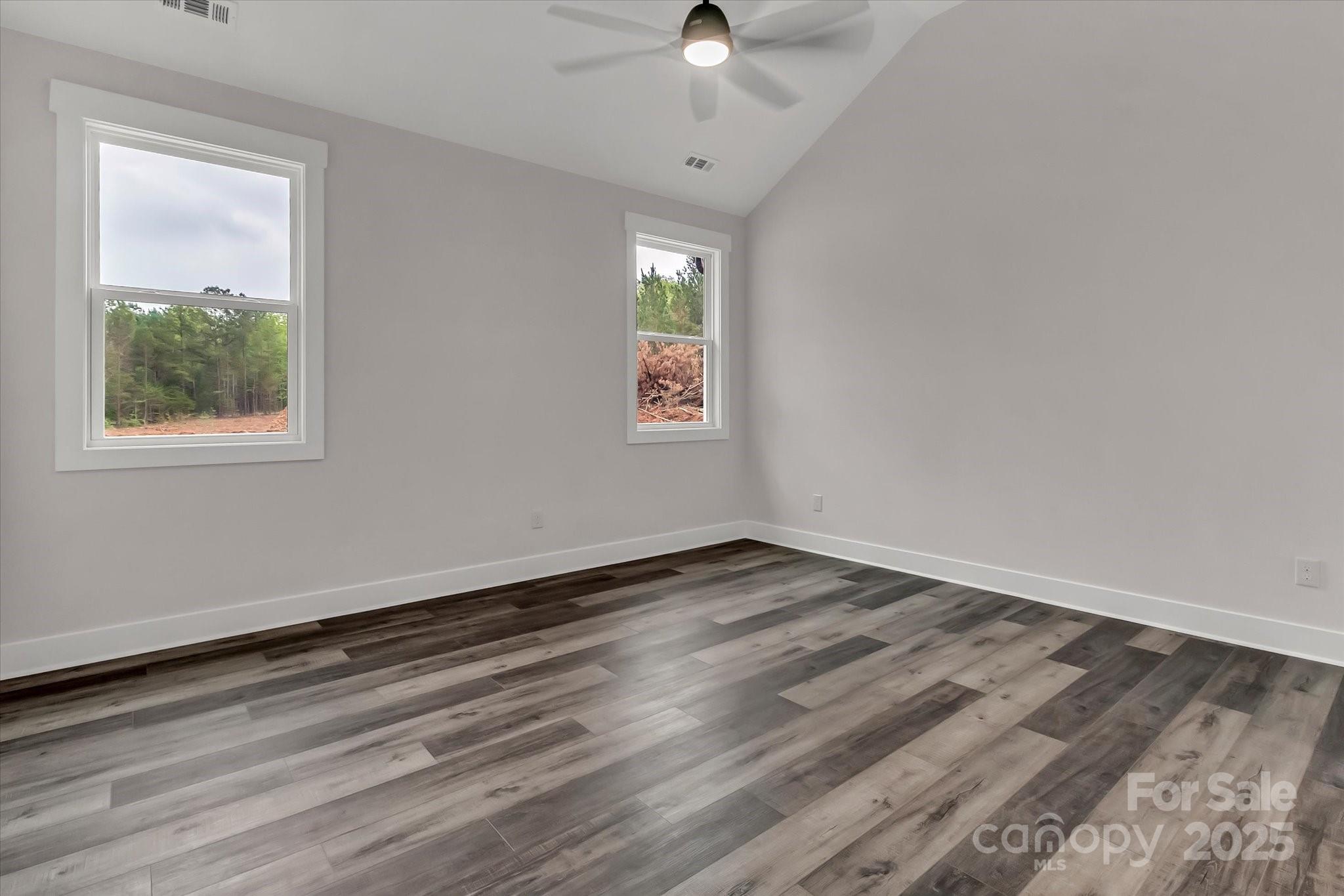 2147 Dunlap Roddey Road Rock Hill, SC 29730 - Photo 16 of 27 a view of an empty room with a window and wooden floor