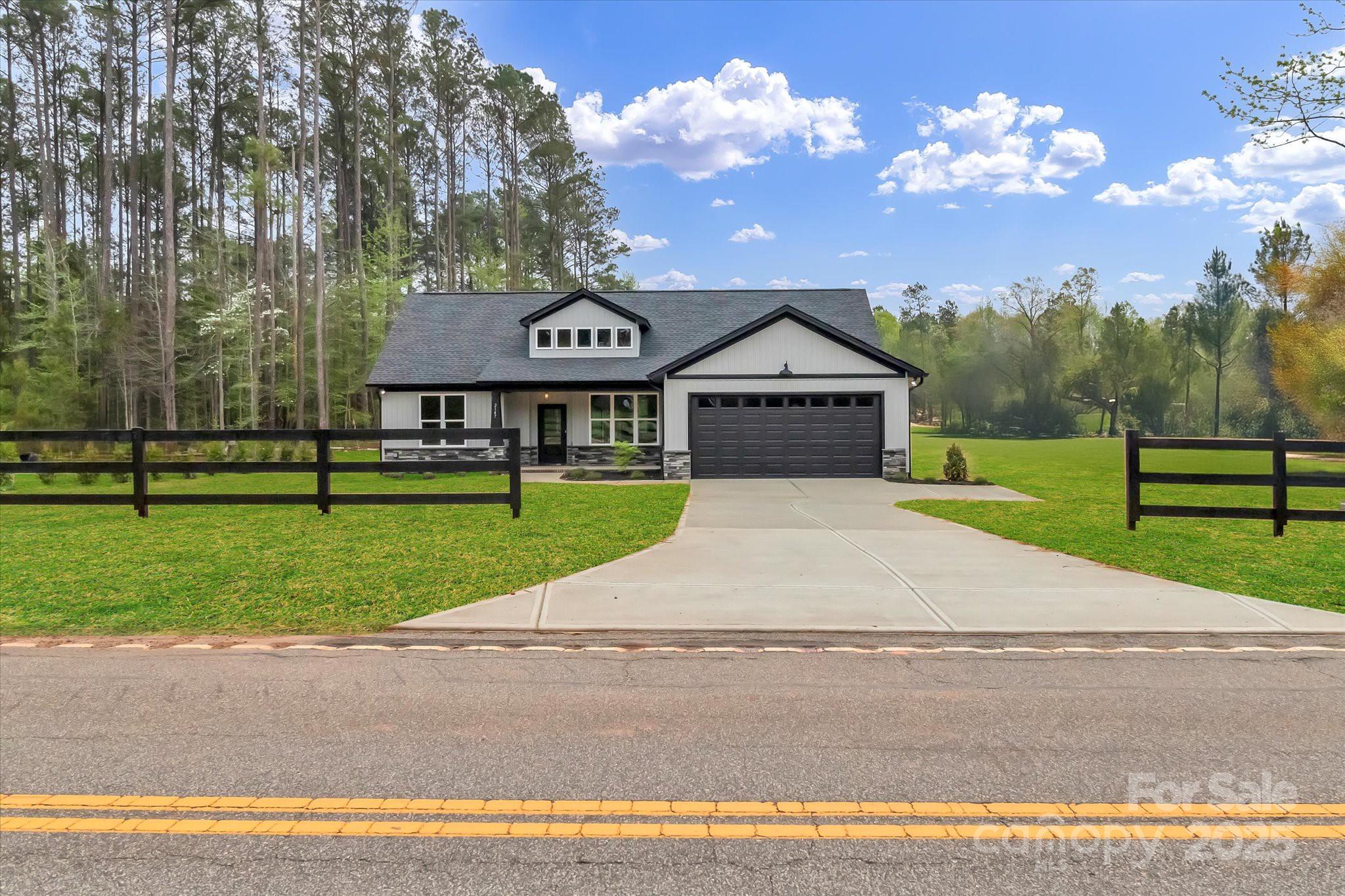2147 Dunlap Roddey Road Rock Hill, SC 29730 - Photo 2 of 27 a front view of a house with garden