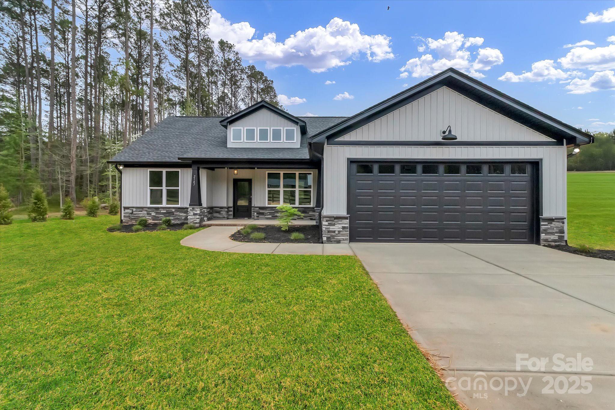 2147 Dunlap Roddey Road Rock Hill, SC 29730 - Photo 3 of 27 a front view of a house with a yard