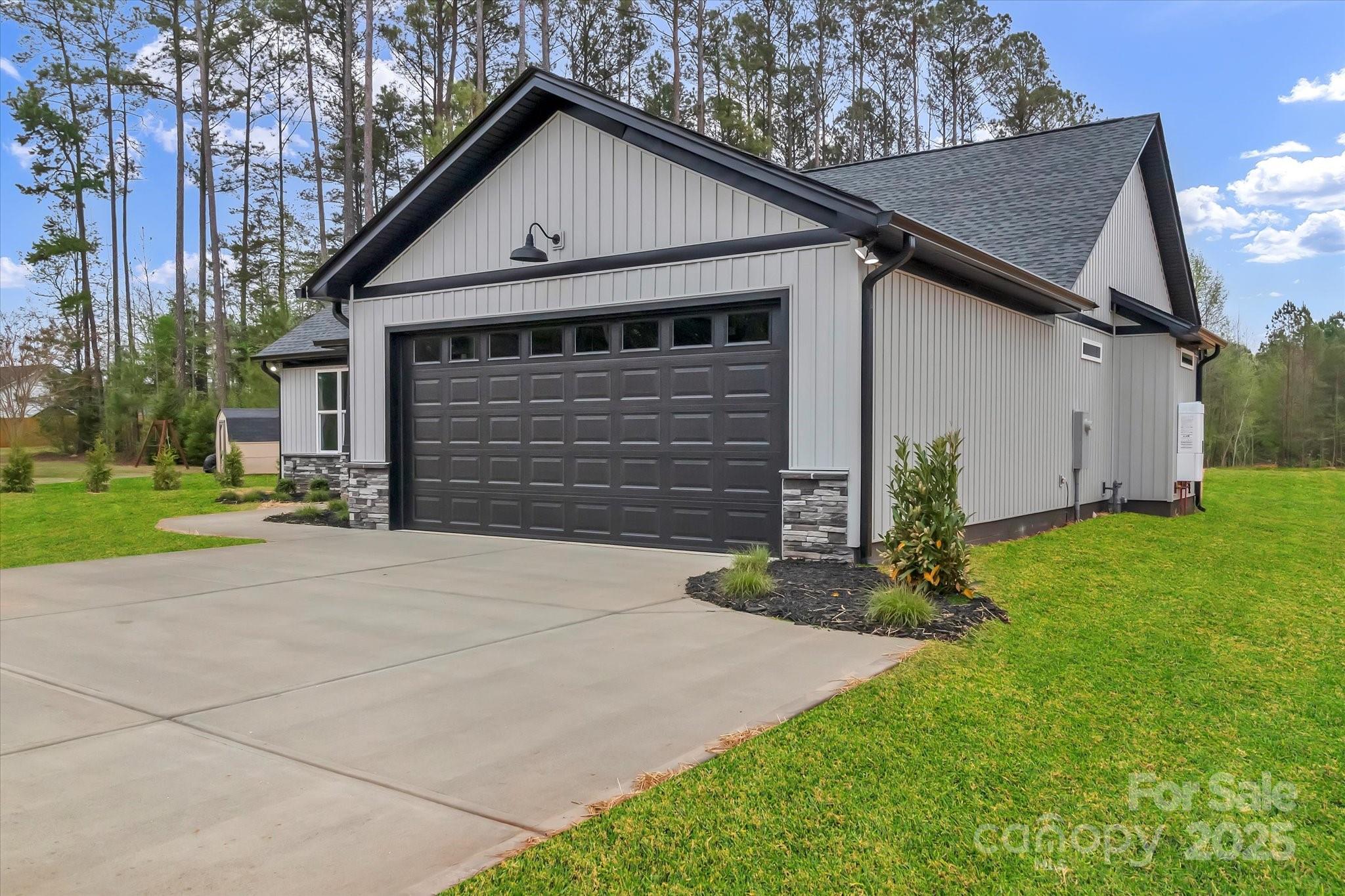 2147 Dunlap Roddey Road Rock Hill, SC 29730 - Photo 4 of 27 a front view of a house with a yard and garage
