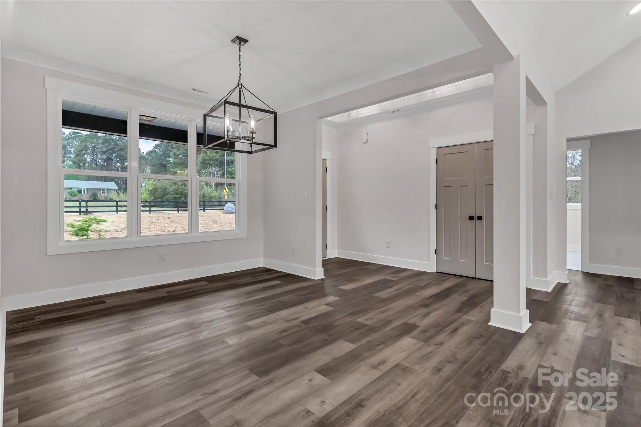 2147 Dunlap Roddey Road Rock Hill, SC 29730 - Photo 9 of 27 a view of an empty room with wooden floor fridge and a window