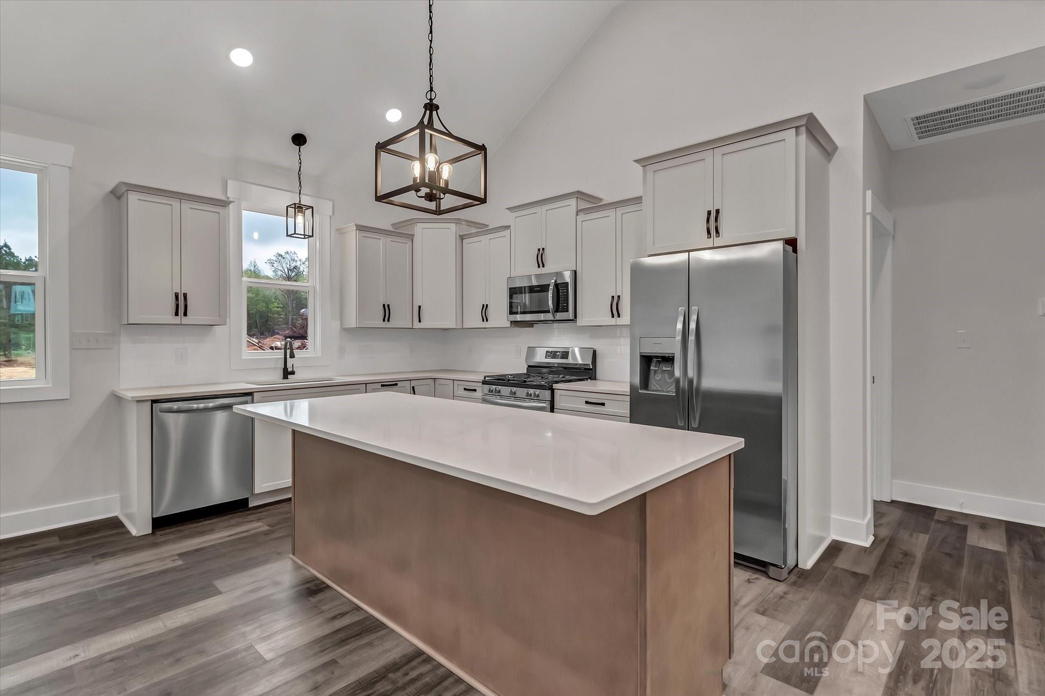 2147 Dunlap Roddey Road Rock Hill, SC 29730 - Photo 10 of 27 a kitchen with refrigerator cabinets and wooden floor