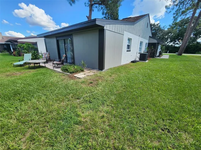 a view of a house with a yard