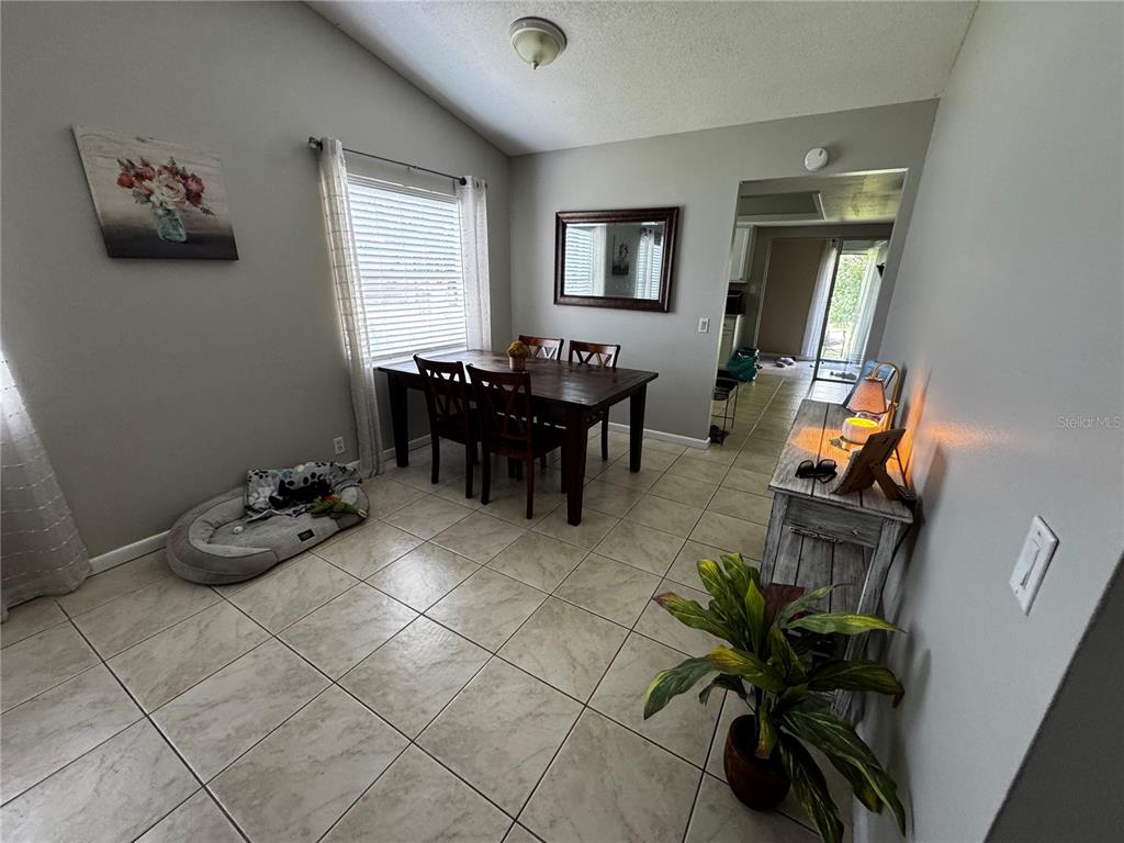 423 Greenfield Road Winter Haven, FL 33884 - Photo 6 of 14 a living room with furniture and a window