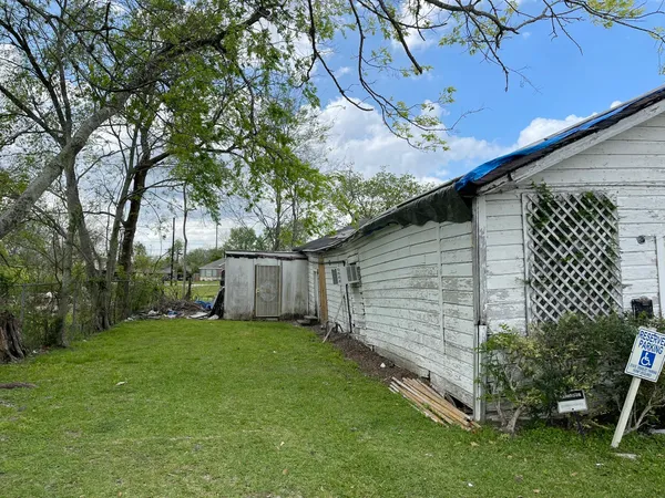 a backyard of a house with lots of green space