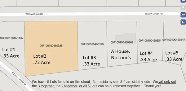 a street sign sitting on a pole on a street