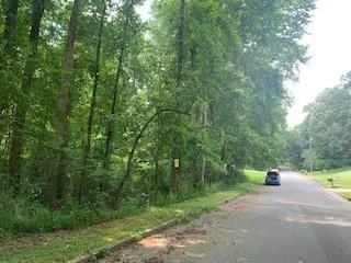 a view of a park with a sign board