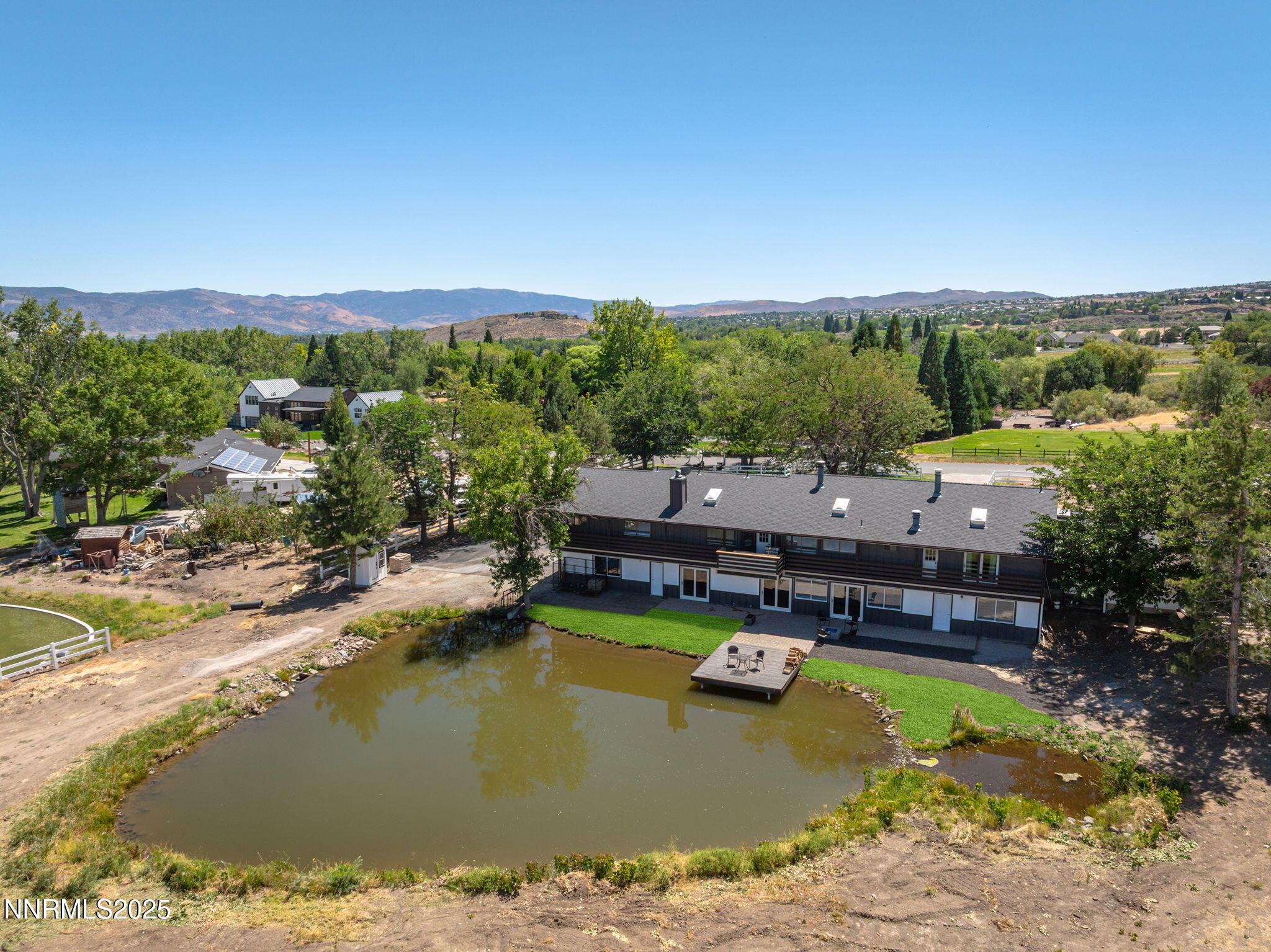 3485 Frost Lane Reno, NV 89511 - Photo 3 of 44 a view of swimming pool with lawn chairs under an umbrella
