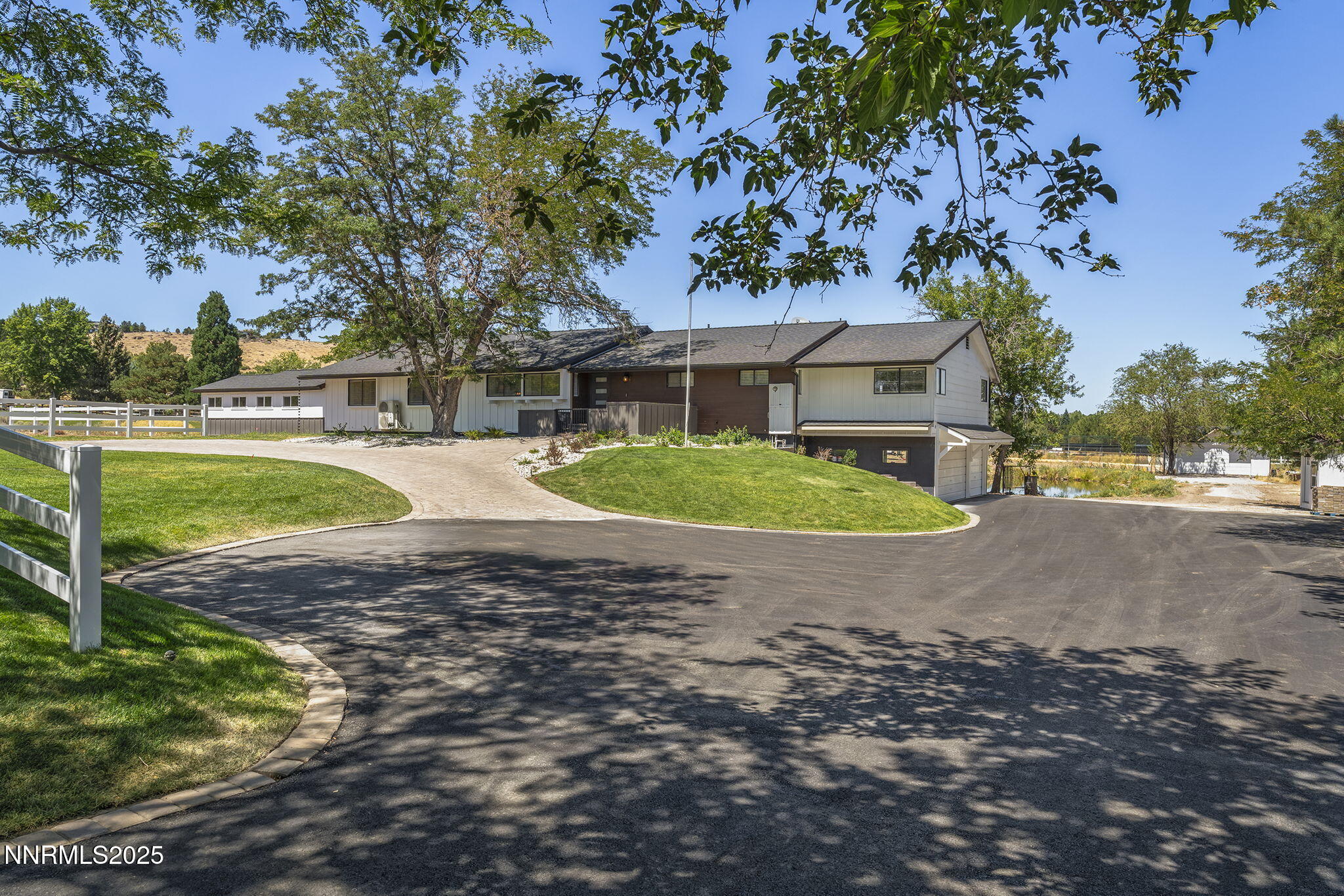 3485 Frost Lane Reno, NV 89511 - Photo 5 of 44 a view of a house with a big yard and large tree