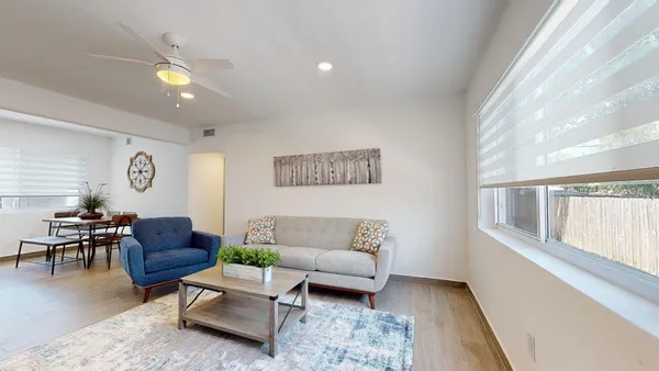 a living room with furniture and a window