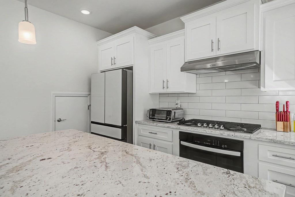 13871 Petersen Ranch Drive Pine Grove, CA 95665 - Photo 18 of 74 a kitchen with stainless steel appliances a refrigerator stove and cabinets
