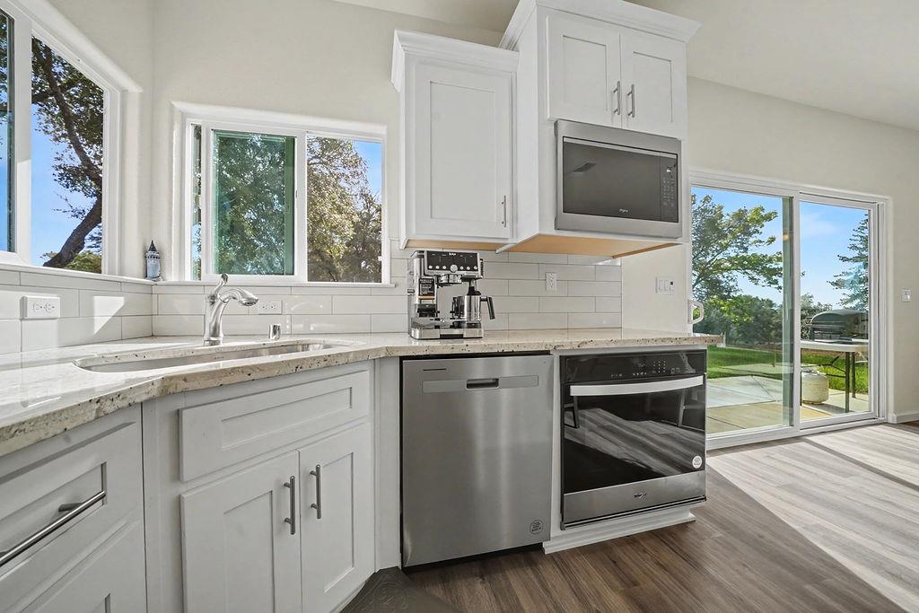 13871 Petersen Ranch Drive Pine Grove, CA 95665 - Photo 22 of 74 a kitchen with sink cabinets and window