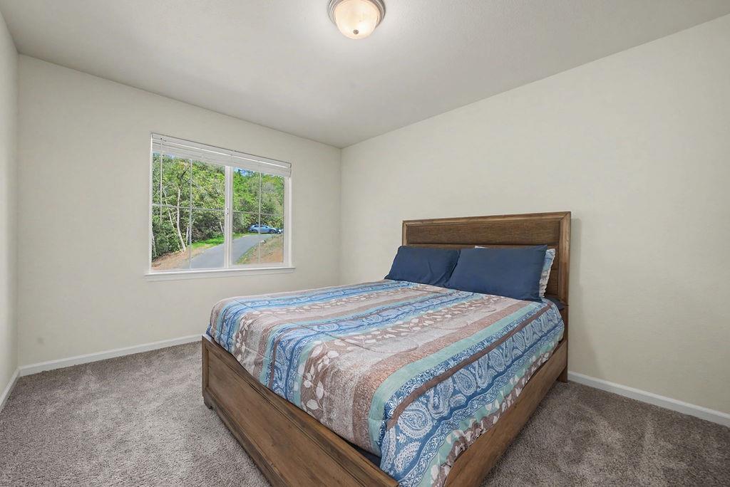 13871 Petersen Ranch Drive Pine Grove, CA 95665 - Photo 28 of 74 a bedroom with a bed and a window