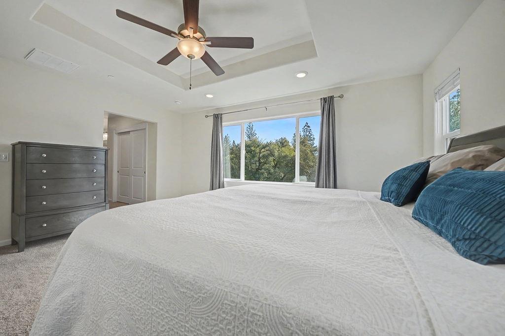 13871 Petersen Ranch Drive Pine Grove, CA 95665 - Photo 38 of 74 a bedroom with a large bed and a large window