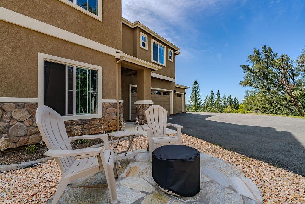 13871 Petersen Ranch Drive Pine Grove, CA 95665 - Photo 48 of 74 a view of a patio with table and chairs and potted plants