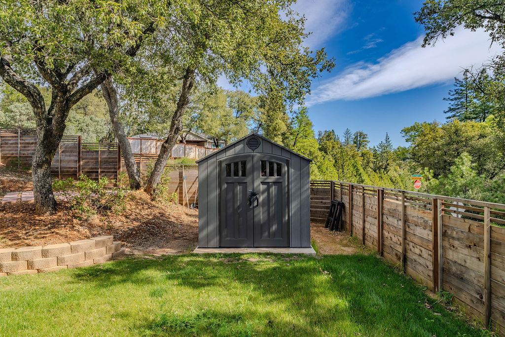 13871 Petersen Ranch Drive Pine Grove, CA 95665 - Photo 55 of 74 a view of a wooden house with a big yard and large trees