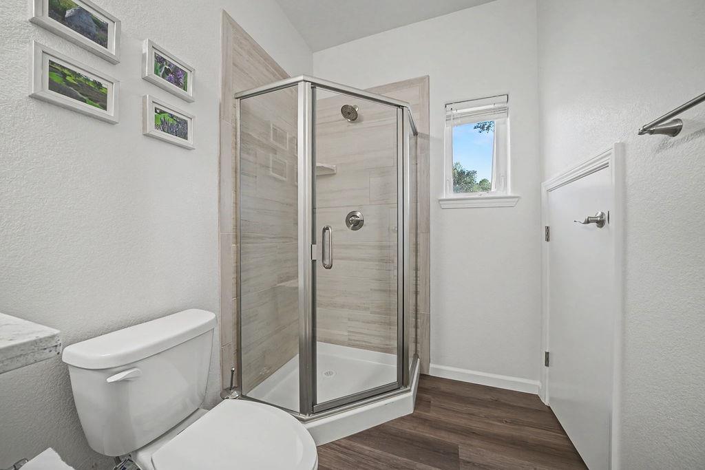 13871 Petersen Ranch Drive Pine Grove, CA 95665 - Photo 6 of 74 a bathroom with a shower a toilet and a sink
