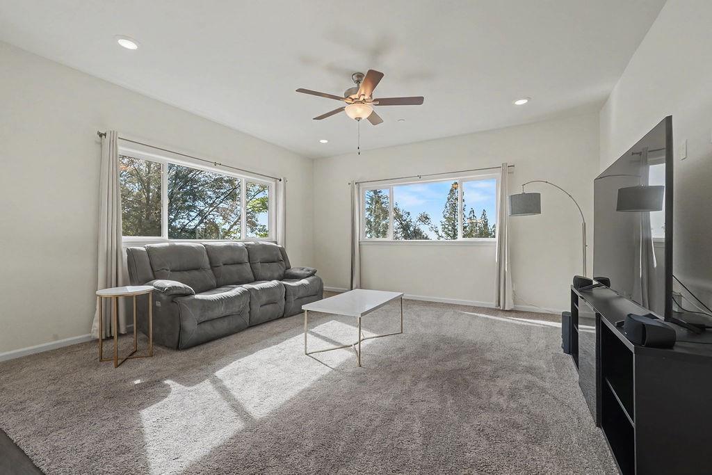 13871 Petersen Ranch Drive Pine Grove, CA 95665 - Photo 7 of 74 a living room with furniture a flat screen tv and a window