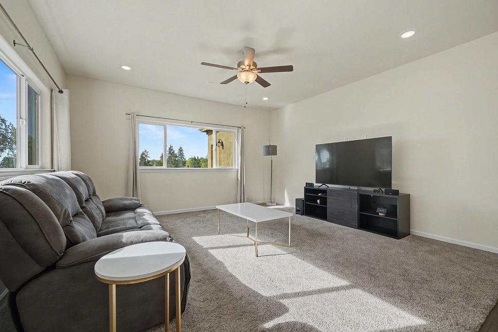 13871 Petersen Ranch Drive Pine Grove, CA 95665 - Photo 8 of 74 a living room with furniture and a flat screen tv