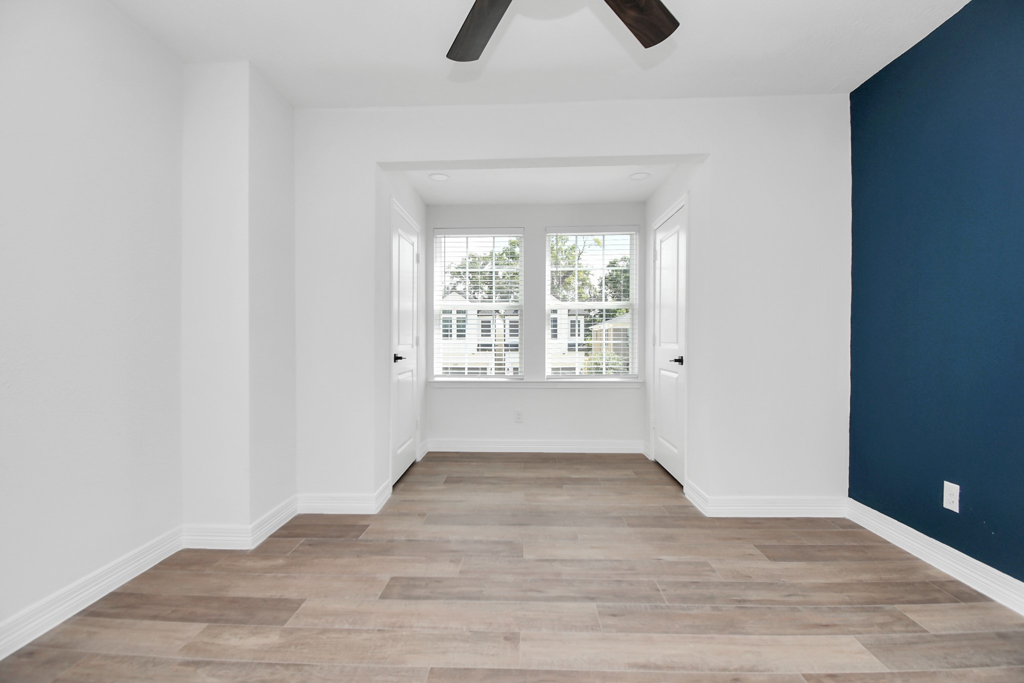 2812 Truxillo Street, Unit B Houston, TX 77004 - Photo 26 of 32 wooden floor in an empty room with a window
